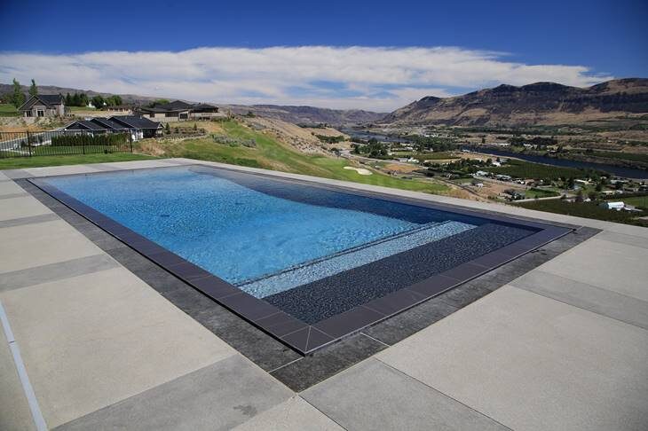 Infinity pool with mountain valley view