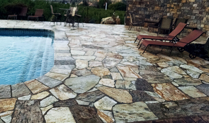 Flagstone patio and pool with stone wall
