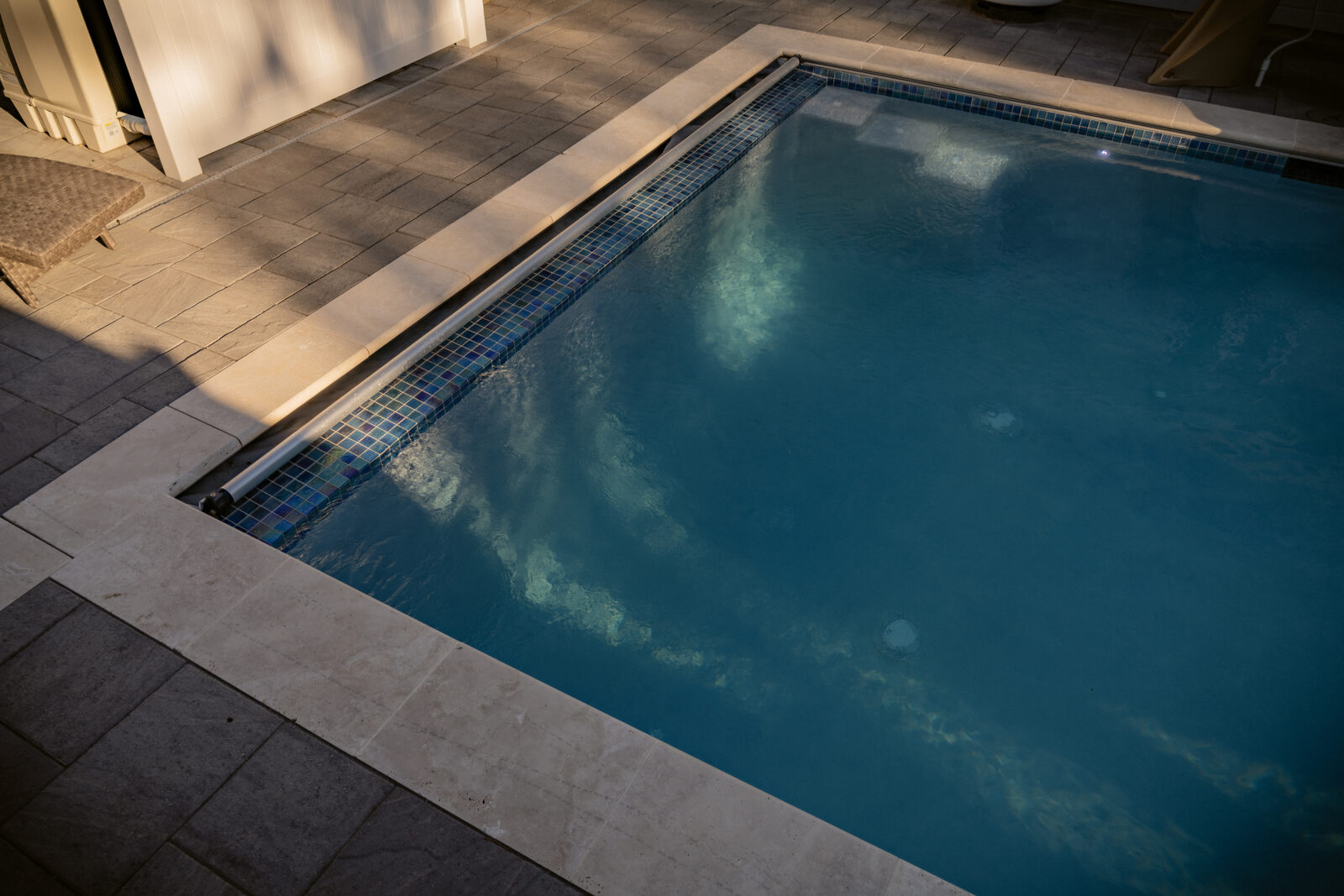 Custom pool detail with glass mosaic waterline tile