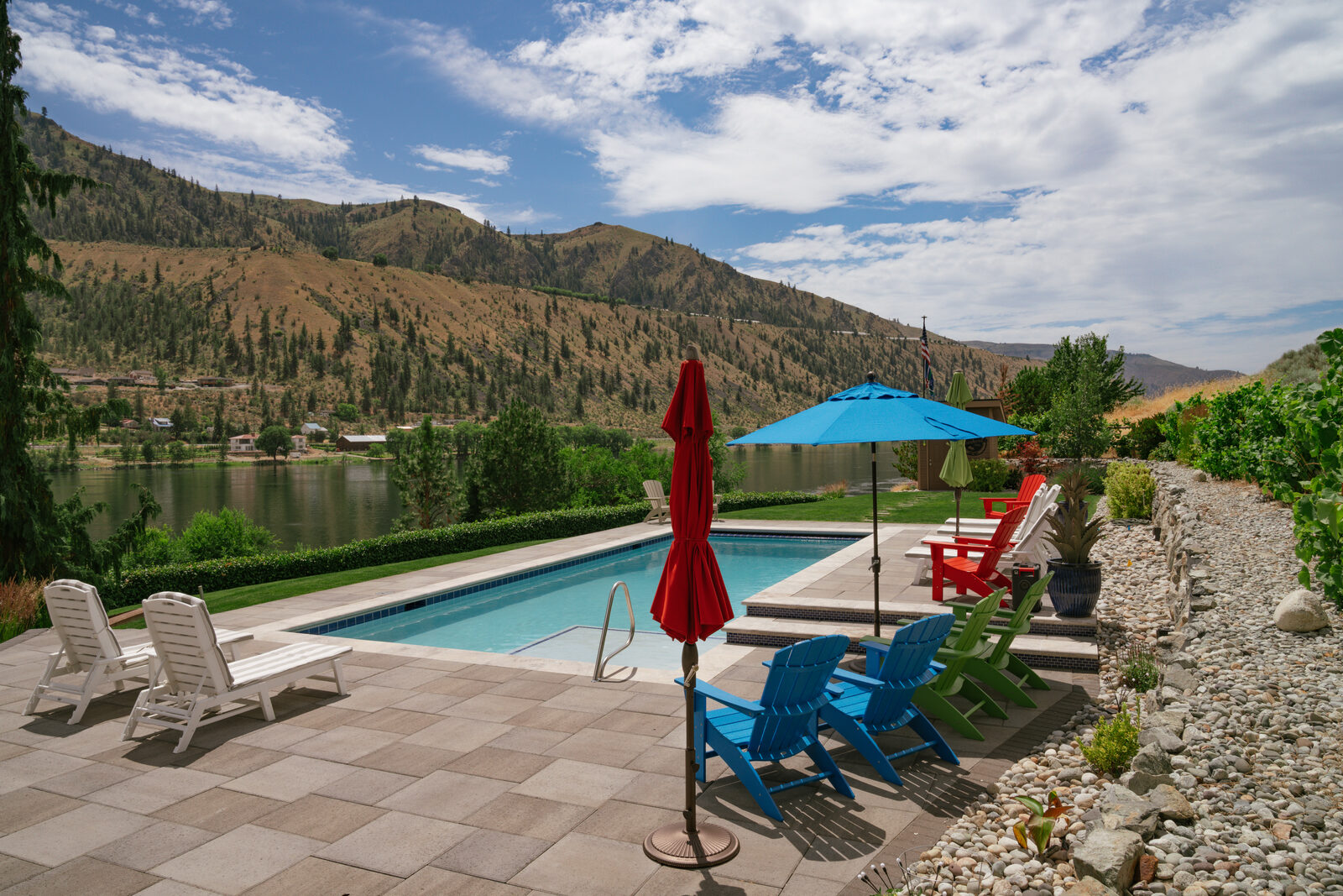 Riverside custom pool with mountain reflection